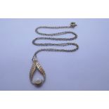 9ct yellow gold drop shaped pendant mounted with a single pearl on an unmarked yellow metal chain, w