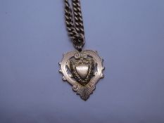 9ct yellow gold chain hung with heart shaped medallion, marked 375, with lobster claw clasp, approx