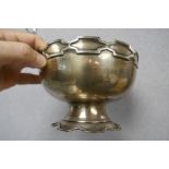 A decorative silver fruit bowl having patterned rim and matching pedestal foot. Hallmarked Birmingha
