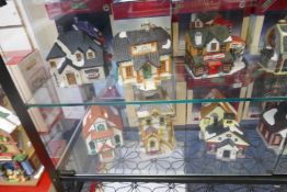 Lemax;Two shelves of small Christmas model displays (12)