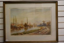 An early 20th century watercolour of figures and cattle beside river, signed, 71 cm x 47 cm