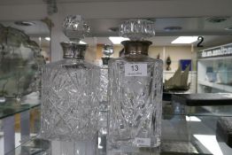Two attractive cut glass decanters having silver collars. One hallmarked Birmingham 1980 Roberts and