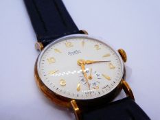 A Bentima star 9ct gold watch with round face and a decorative dial. Swiss made and having subsidiar