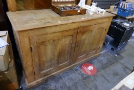 A large pitch pine dresser having pair of cupboard doors with shelf back