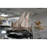 A Silver Maltese model of a boat on a stand. A very attractive piece, appears to be of high quality.