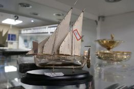 A Silver Maltese model of a boat on a stand. A very attractive piece, appears to be of high quality.