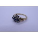 9ct sapphire and diamond cluster ring with three oval sapphires surrounded with small diamonds, size