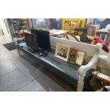 A large Victorian style grey painted hall bench having scross arms, 280 cms