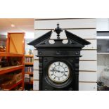 A late Victorian black painted Vienna wall clock