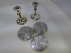 A set of six silver coasters by W I Broadway and Co. Engine turned design, Birmingham 1973. Also wit