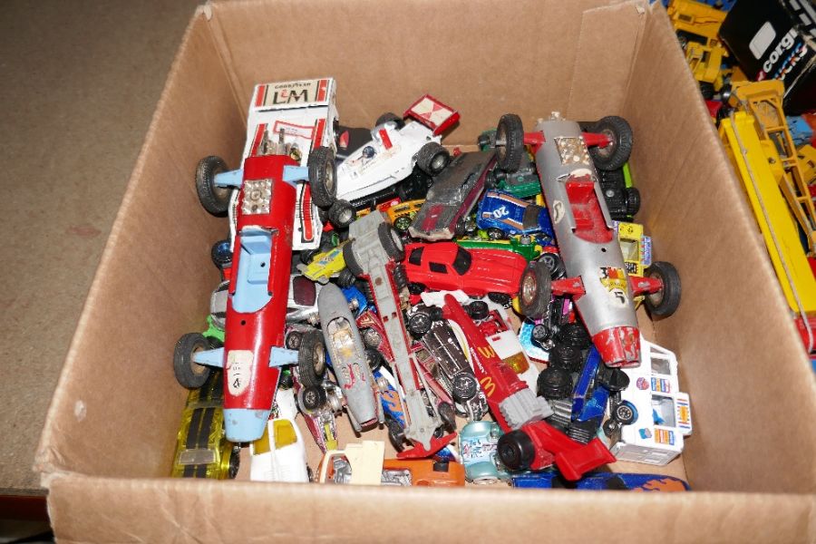 Two trays of vintage playworn die cast vehicles including construction examples