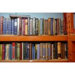 Three shelves of Folio Society publications, approximately 210