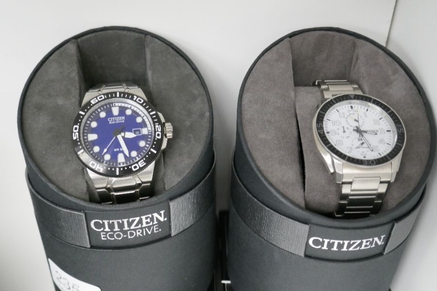 A pair of Citizen Eco-Drive watches case no.s E168-SO89379 Purchased March 2014 and 8637-SO80975 Pur