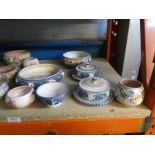 A quantity of Poole pottery bowls, butter dishes, sugar bowls, coffee cups, etc