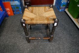 An oak rush seated stool