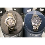 A pair of Citizen Eco-Drive watches case no.s E650-SO75157 Purchased Jan 2014 and H145-SO73316 Purch