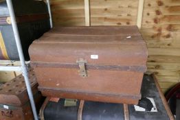 A quantity of old tin trunks and others