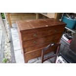 An antique mahogany chest of drawers and an old under-bed wooden trunk