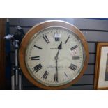 An old fusee circular wall clock by Saunders of Dorchester, the dial 15 inches