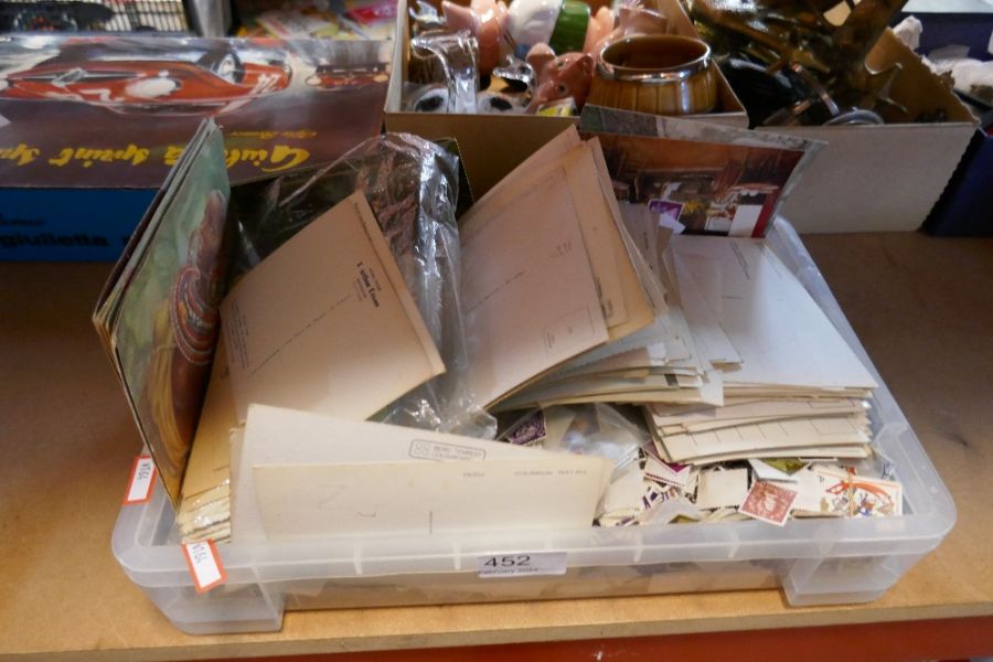 A small box of used stamps and tourist postcards