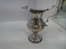 A very pretty Georgian silver creamer by Hester Bateman. A high quality decorative piece having acan