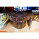 An antique brown leather Top Hat box