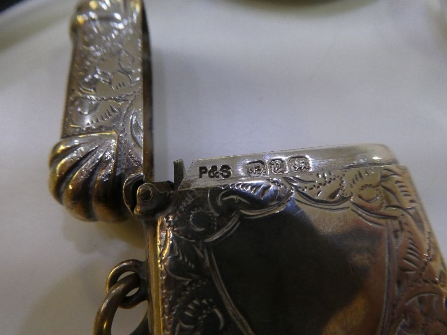 A silver toast rack by Mappin and Webb, on four ball feet. With a heavily decorated Victorian Vesta - Image 5 of 5