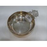 A silver Victorian porringer by Henry Stratford. The handle portrays two figures in a pierced foliat