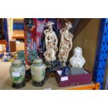 A selection of mostly oriental figures and a box containing various collectables, including badges,
