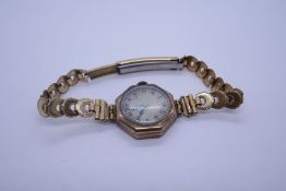 Antique 9ct gold cased octagonal shaped watch on plated strap, inscription to reverse