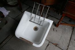 An old Twyfords clothes washing sink, with folding rack