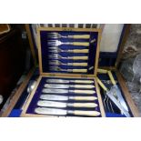 A silver plated set of 6 Fish knives and forks, in fitted case and a canteen of cutlery