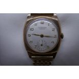 9ct yellow gold Gent's wristwatch by J. W. Benson. With a champagne dial, numbered and seconds dial,