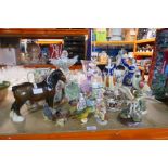 A selection of collectable figures including Beswick, Doulton, etc