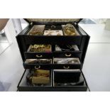 Black modern jewellery case containing various vintage and modern costume jewellery including brooch