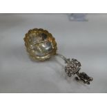 A silver highly decorative spoon, possibly Dutch with the Minerva mark, having pierced design handle