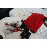 A Red Military waistcoat, two pairs of trousers, belts, spurs, etc