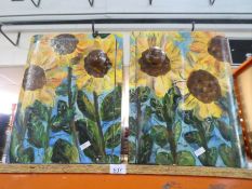A pair of painted cupboards decorated sunflowers
