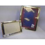 A pretty rectangular silver photoframe by W I Broadway and Co., Birmingham 1991, having ornate borde