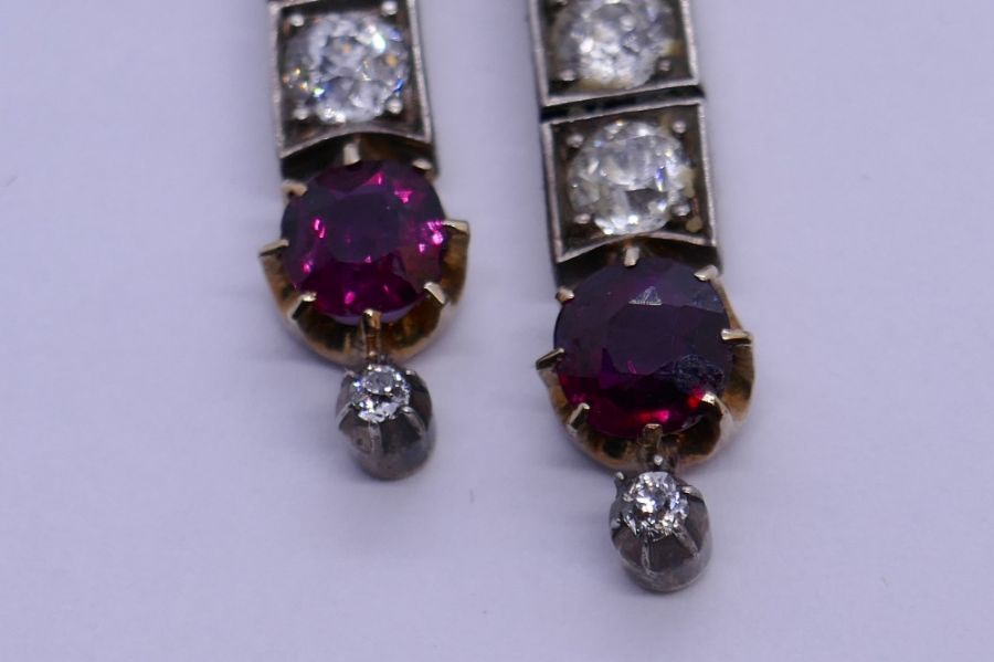 An impressive Victorian ruby and diamond brooch, with form of a bow with central round cut ruby surr - Image 7 of 8
