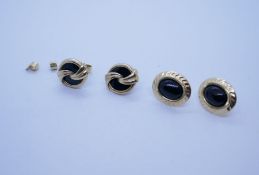 Two pairs of 9ct gold oval earrings inset black stones, both marked 375
