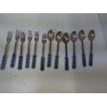 A quantity of six Korean silver teaspoons and dessert forks, having enamel handles, marked 70 silver