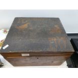 An Oak box having carved lid with writing Lord Derby Newmarket 1917. The contents including Cock fig