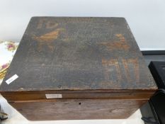 An Oak box having carved lid with writing Lord Derby Newmarket 1917. The contents including Cock fig