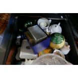 A shelf of sundry including china, glass and a set of kitchen scales