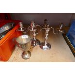 A Silver trophy cup, a pair of Harrods silver plated twin sconce candlesticks and sundry metalware