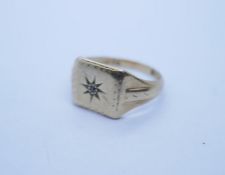 9ct yellow gold gents signet ring with rectangular panel with starburst set diamond chip marked 375,
