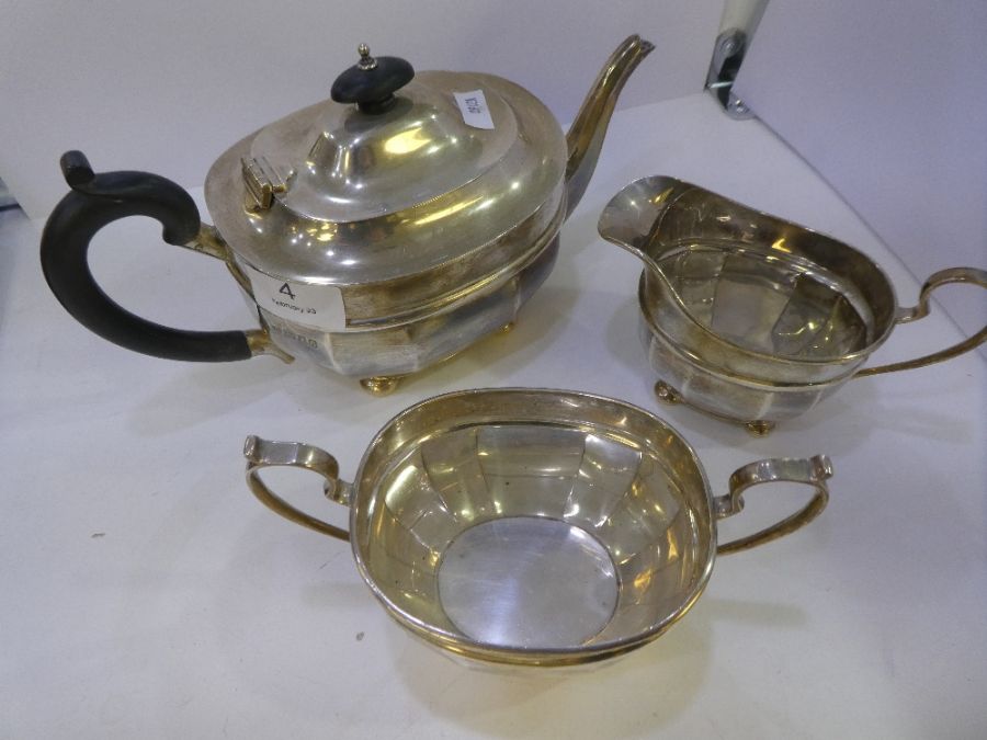 A London silver tea service by James Hardy and Co.  Comprising a teapot, sugar bowl and milk jug on