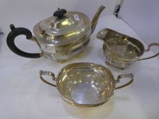 A London silver tea service by James Hardy and Co.  Comprising a teapot, sugar bowl and milk jug on