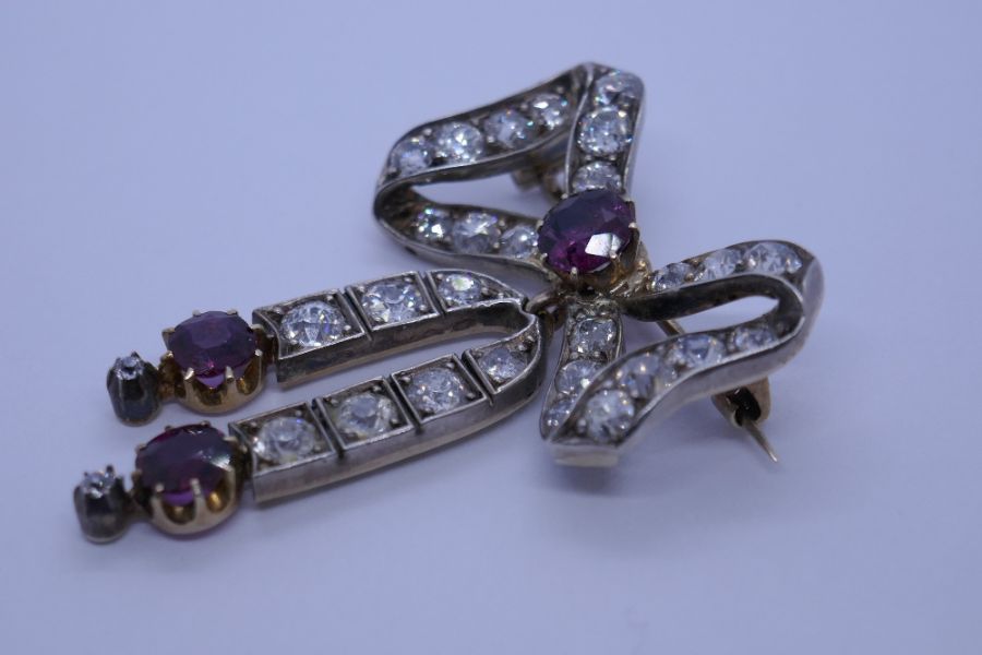 An impressive Victorian ruby and diamond brooch, with form of a bow with central round cut ruby surr - Image 3 of 8